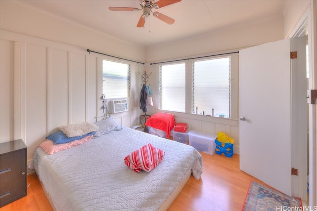 bedroom with ceiling fan and light wood-type flooring