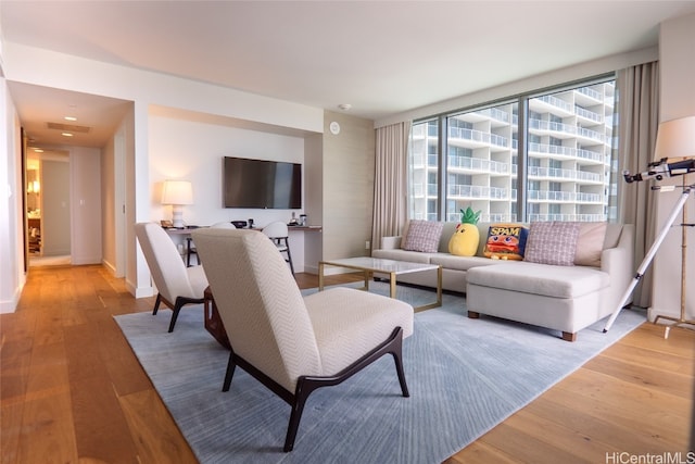 living room with light hardwood / wood-style flooring