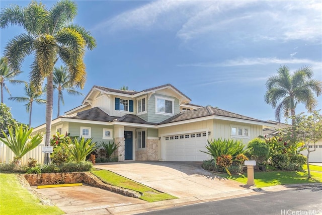 view of front of house with a front lawn and a garage