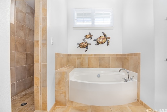 bathroom with tile patterned floors and separate shower and tub