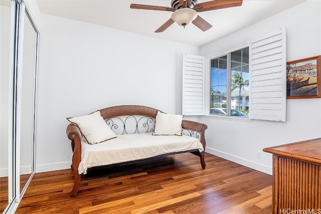 sitting room featuring ceiling fan and hardwood / wood-style flooring