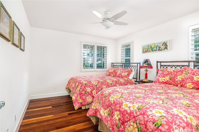 bedroom featuring dark hardwood / wood-style flooring and ceiling fan