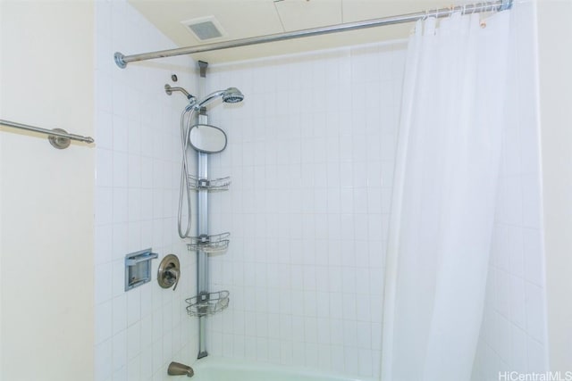 bathroom featuring shower / bath combination with curtain