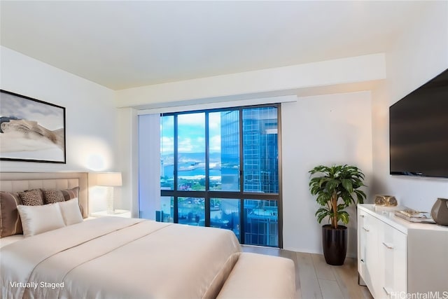 bedroom with light hardwood / wood-style floors