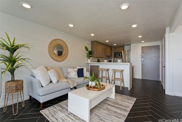 living room featuring a textured ceiling