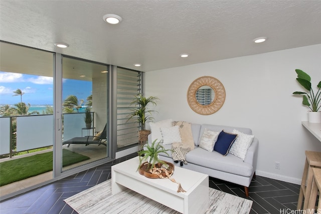 living room featuring a textured ceiling