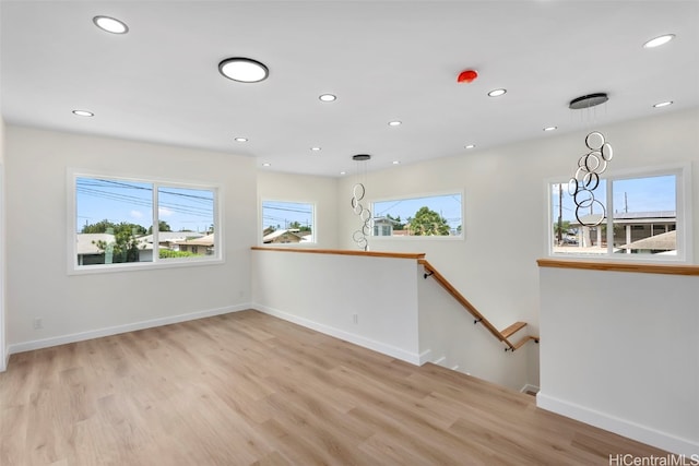 empty room with light hardwood / wood-style floors