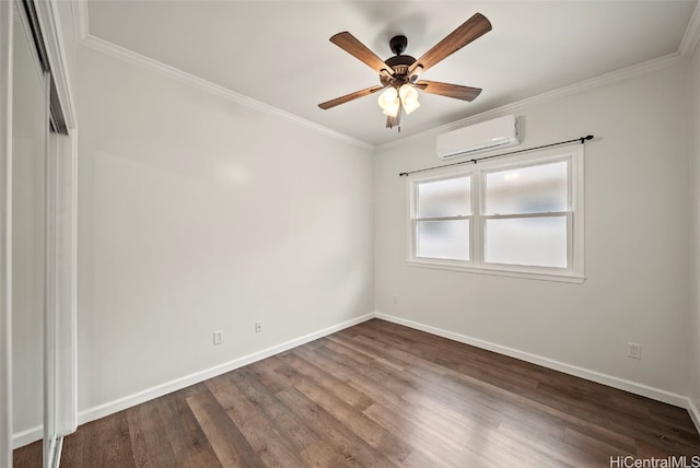 empty room featuring a wall mounted air conditioner, ornamental molding, wood-type flooring, and ceiling fan