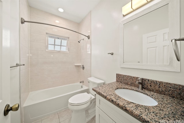 full bathroom with vanity, tiled shower / bath, toilet, and tile patterned flooring