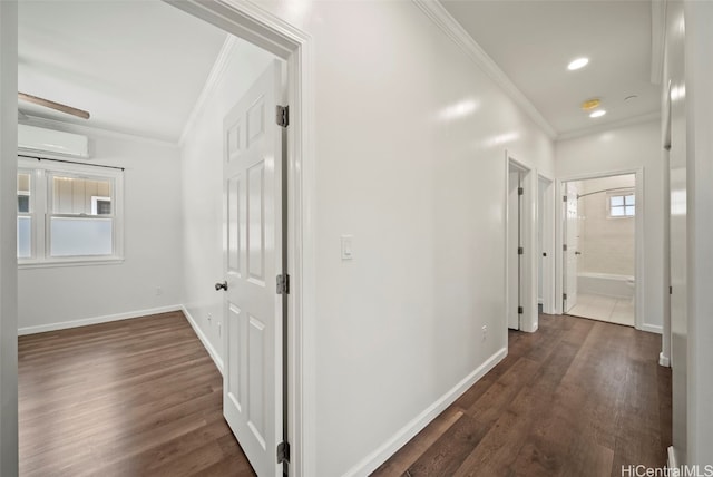 hallway featuring ornamental molding, a wall mounted AC, and dark wood-type flooring