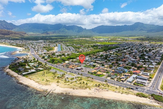 drone / aerial view with a water and mountain view