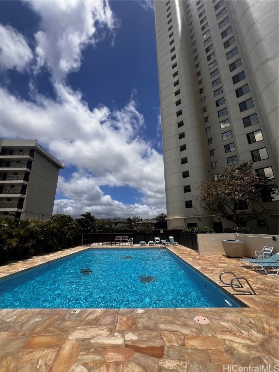 view of swimming pool featuring a patio