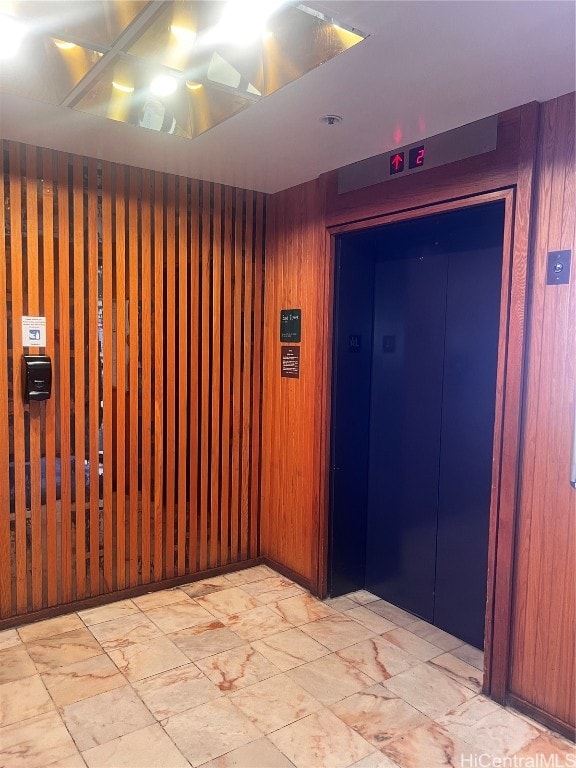 interior space featuring wooden walls