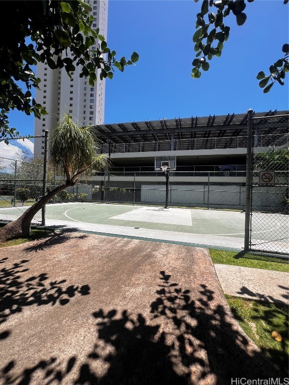 view of property's community featuring basketball court