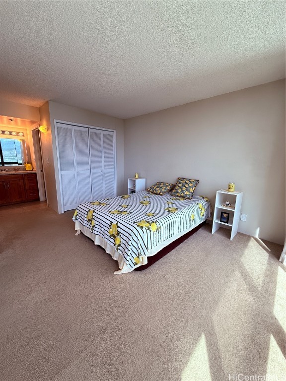 unfurnished bedroom featuring carpet flooring and a textured ceiling