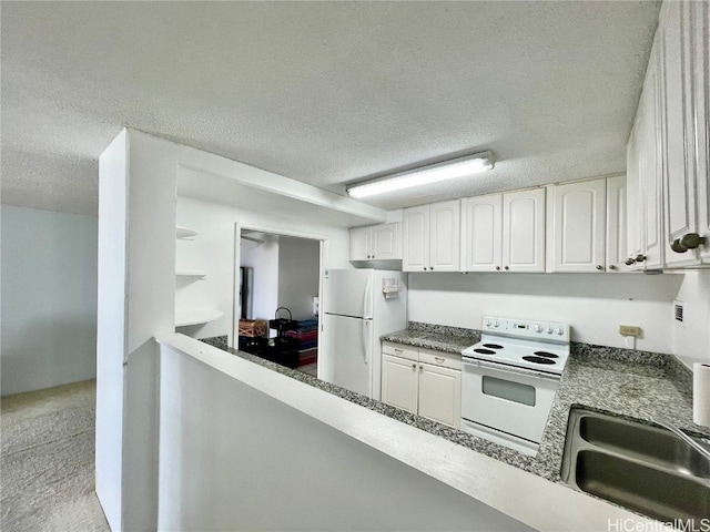 kitchen featuring white cabinets, a textured ceiling, dark stone countertops, sink, and white appliances