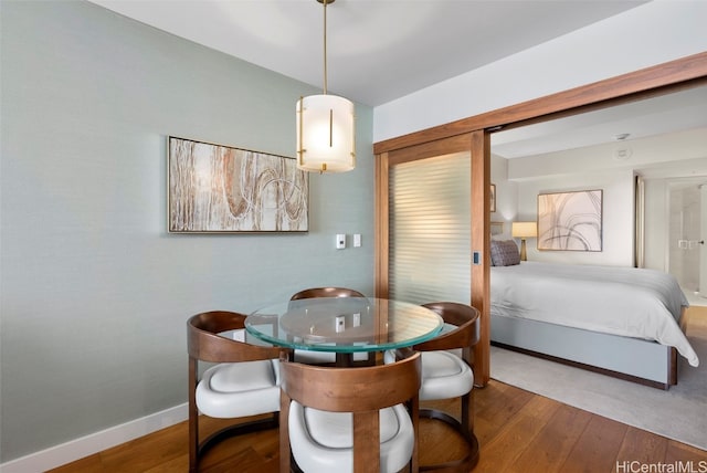 dining space with dark wood-type flooring