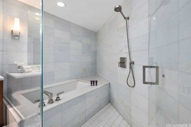 bathroom featuring vanity, tile patterned floors, tile walls, and shower with separate bathtub