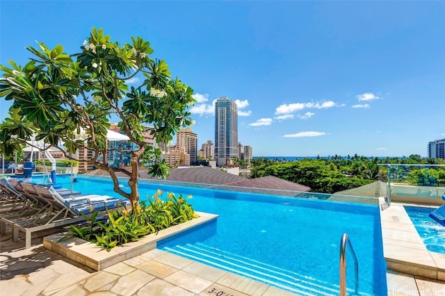 view of swimming pool featuring a patio area