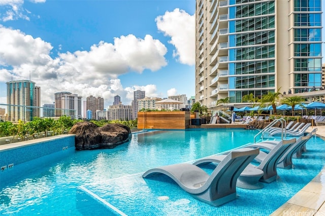 view of pool with pool water feature