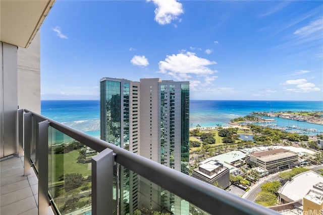 balcony featuring a water view