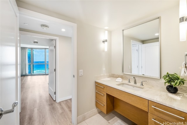 bathroom featuring vanity and hardwood / wood-style floors