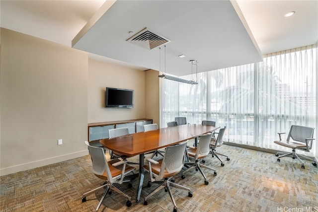 dining area featuring carpet floors and plenty of natural light