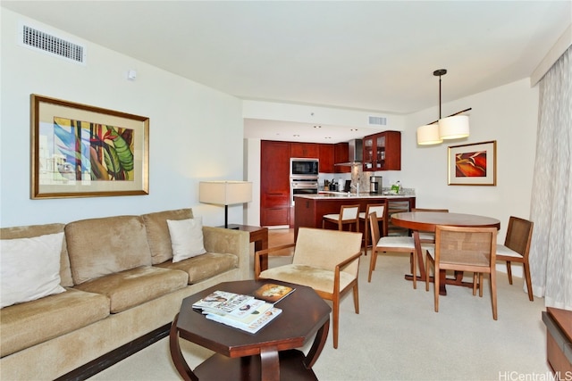 living room featuring light carpet