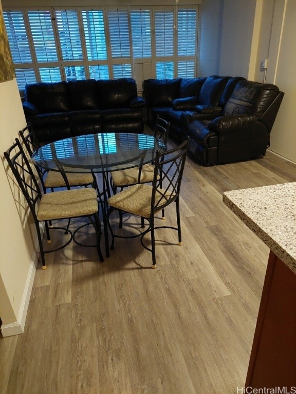 dining space featuring light hardwood / wood-style floors