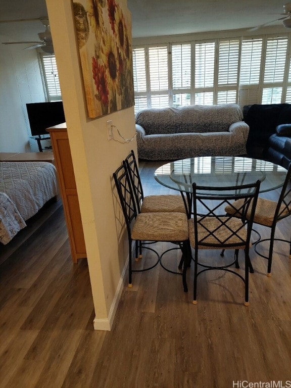 dining room featuring dark hardwood / wood-style floors and ceiling fan