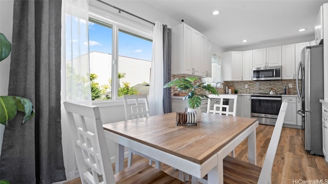 dining room featuring hardwood / wood-style flooring