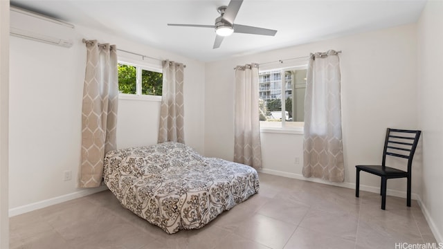 bedroom featuring ceiling fan and a wall mounted AC