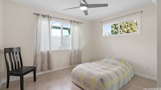 bedroom with multiple windows and ceiling fan