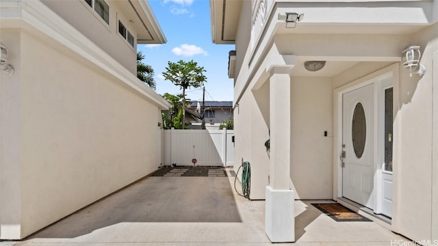 property entrance with a patio