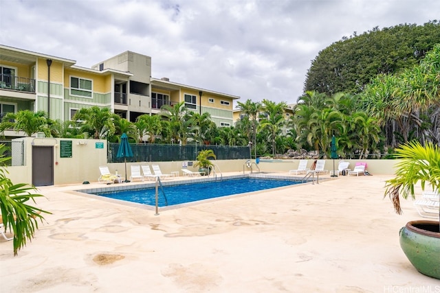 view of swimming pool with a patio