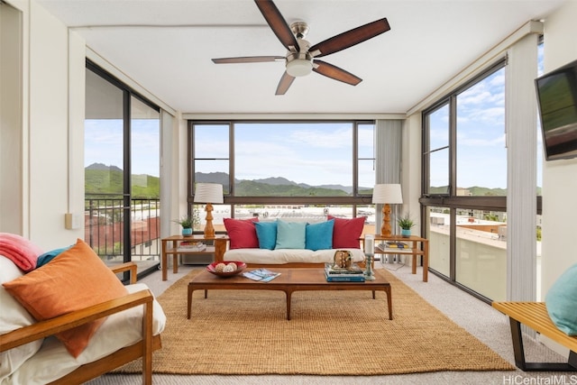 sunroom with plenty of natural light and ceiling fan