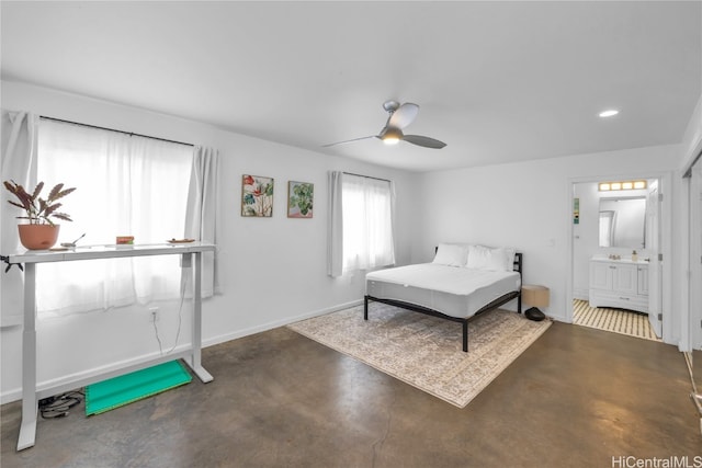 bedroom with ceiling fan and ensuite bath