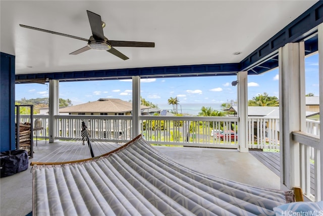 sunroom / solarium with ceiling fan