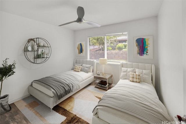 bedroom with hardwood / wood-style floors and ceiling fan