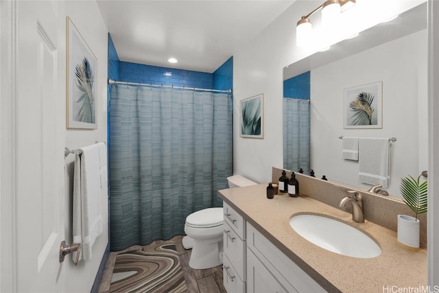 bathroom with vanity, toilet, and a shower with shower curtain