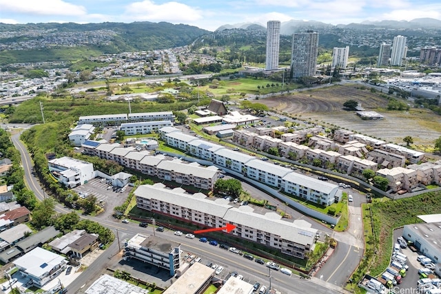 birds eye view of property with a mountain view