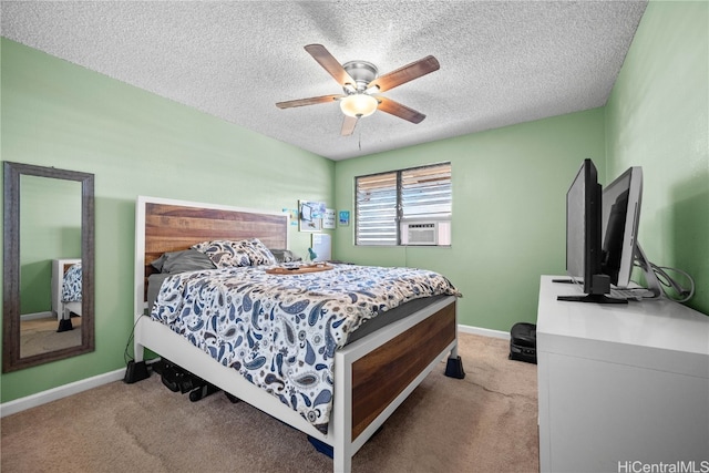 carpeted bedroom featuring cooling unit, a textured ceiling, and ceiling fan