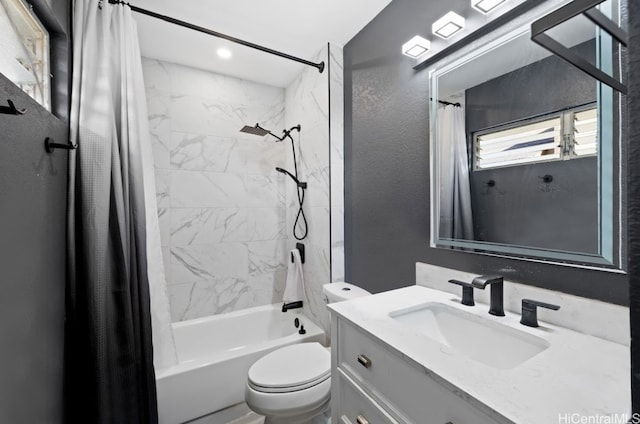 full bathroom featuring vanity, shower / tub combo, and toilet