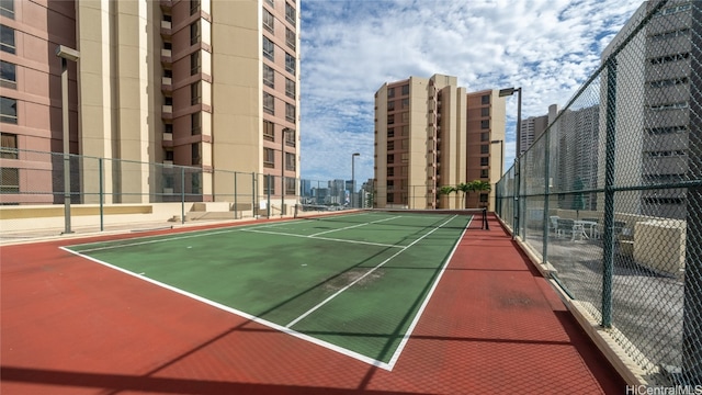 view of sport court with basketball hoop