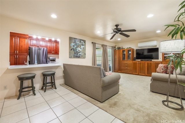 tiled living room featuring a wall unit AC and ceiling fan