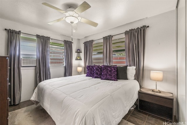 tiled bedroom with ceiling fan