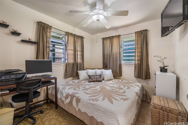 bedroom featuring light tile patterned flooring and ceiling fan