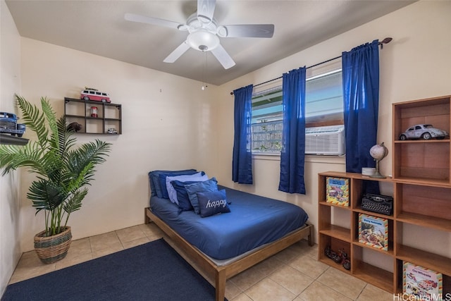 tiled bedroom with ceiling fan and cooling unit