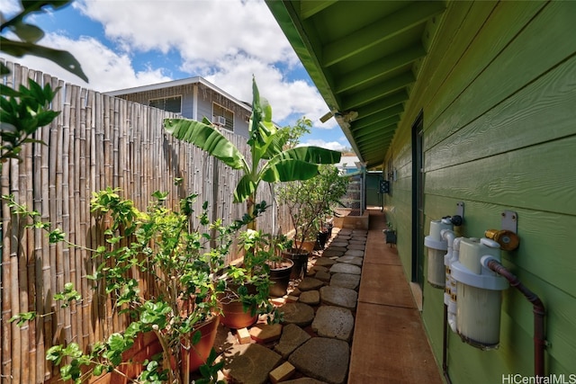 view of property exterior with a patio area