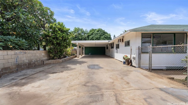 view of side of property with a carport